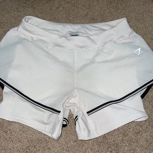 Gymshark shorts size small, built in compression shorts. New without tags